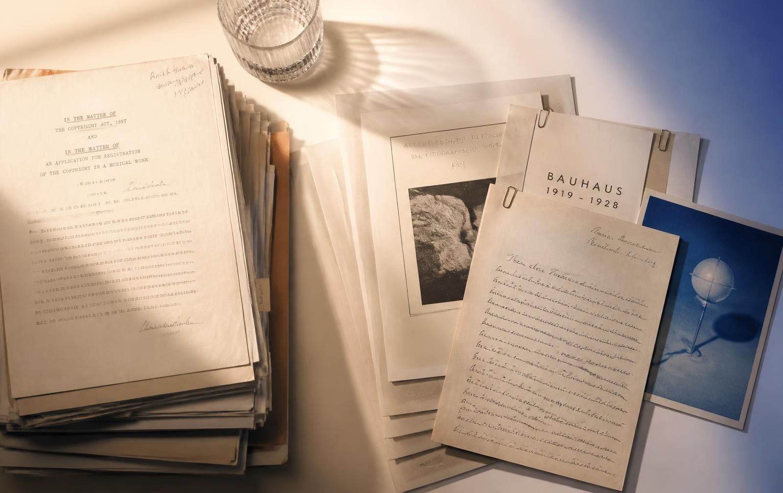 Stacks of scanned documents in warm light
